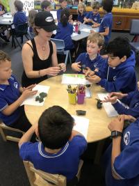 Demonstrating how to mould with wax